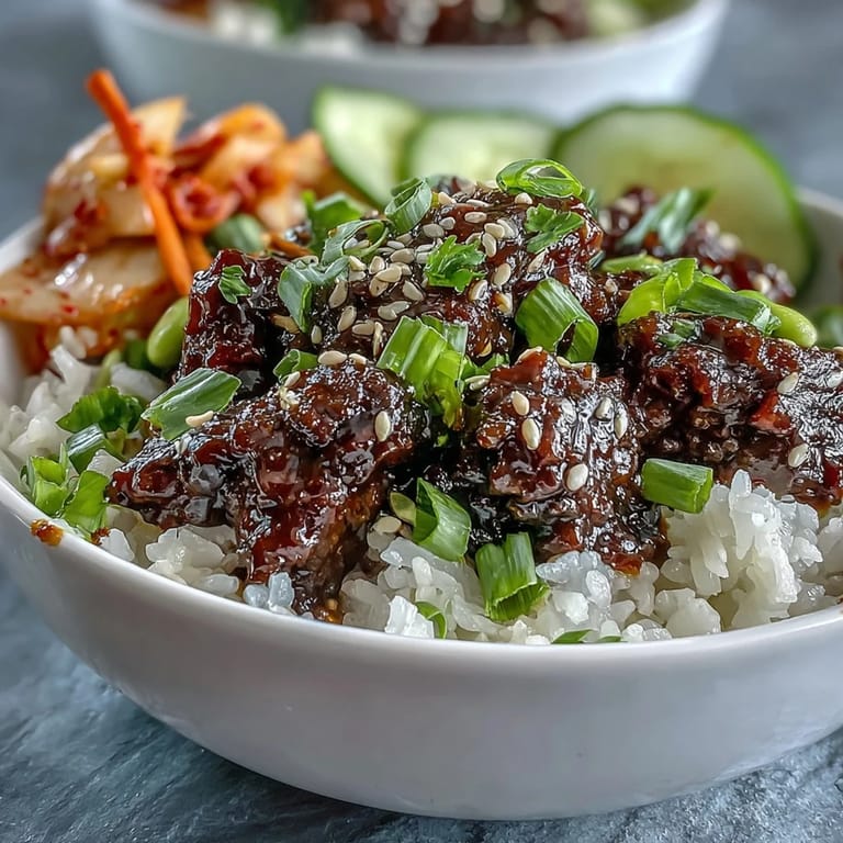 Vibrant Korean Ground Beef Bowl featuring sesame-scented beef, crisp cucumbers, and pickled kimchi for dinner.